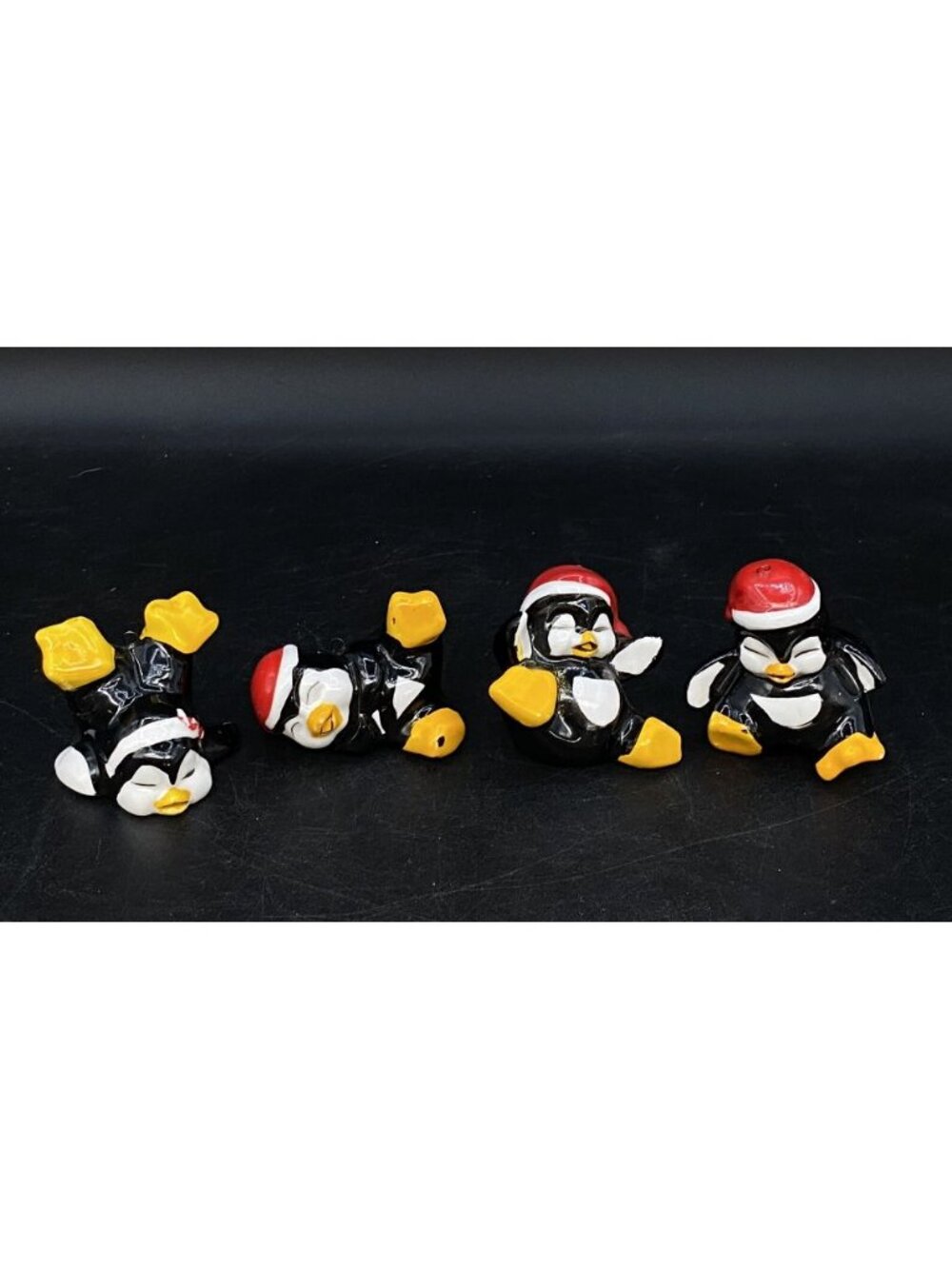 4 Tumbling Playful Penguins Santa Hats Ornament Ceramic Vintage